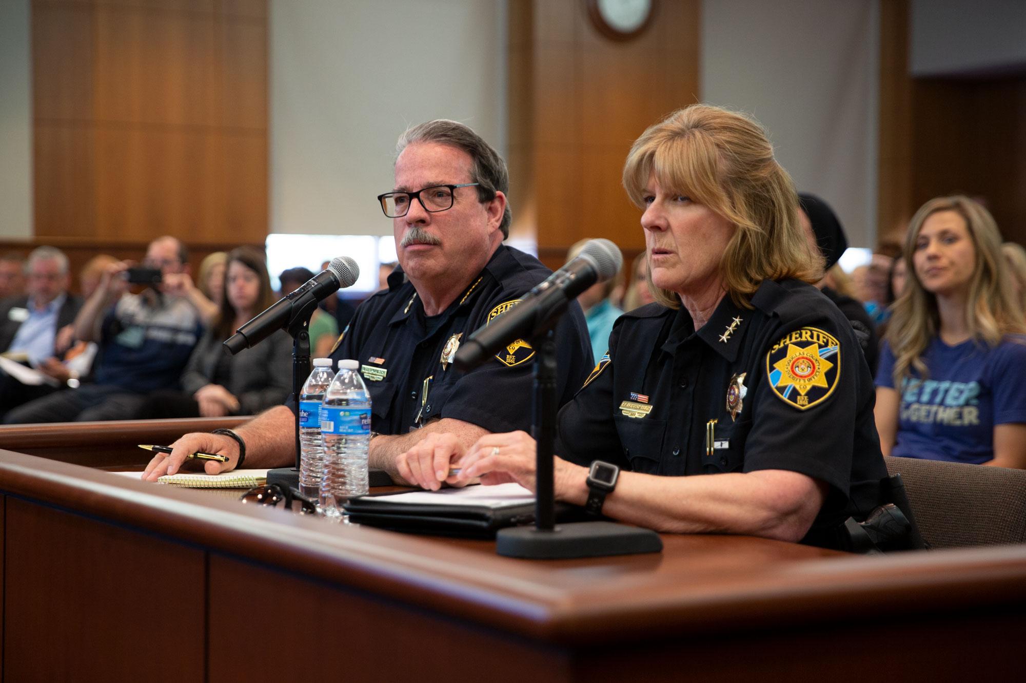 Former Sheriff Tony Spurlock and former Undersheriff Holly Nicholson-Kluth at a Douglas County Commissioners meeting.