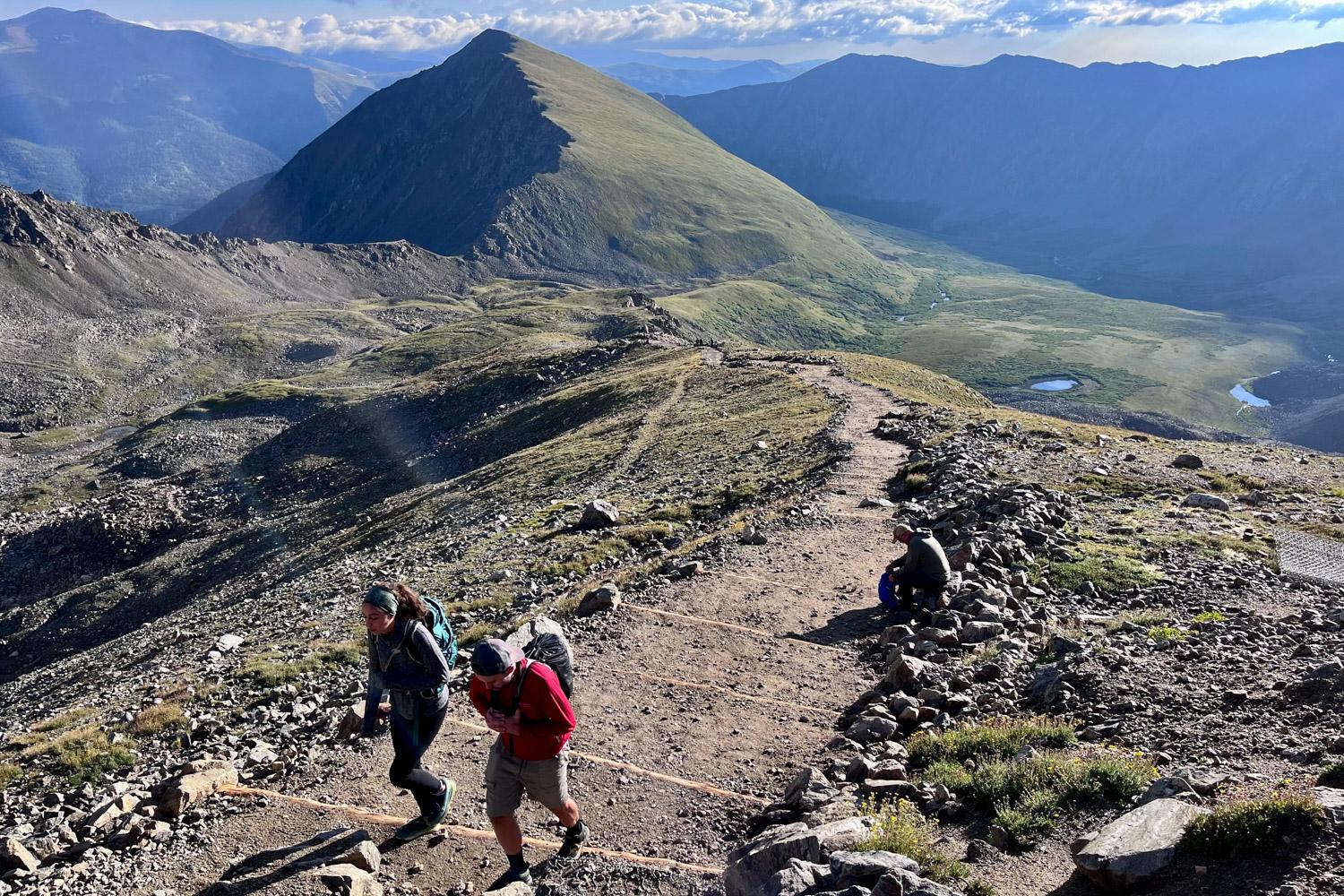 Groups of hikers make their way up to Gray’s and Torrey’s peaks.