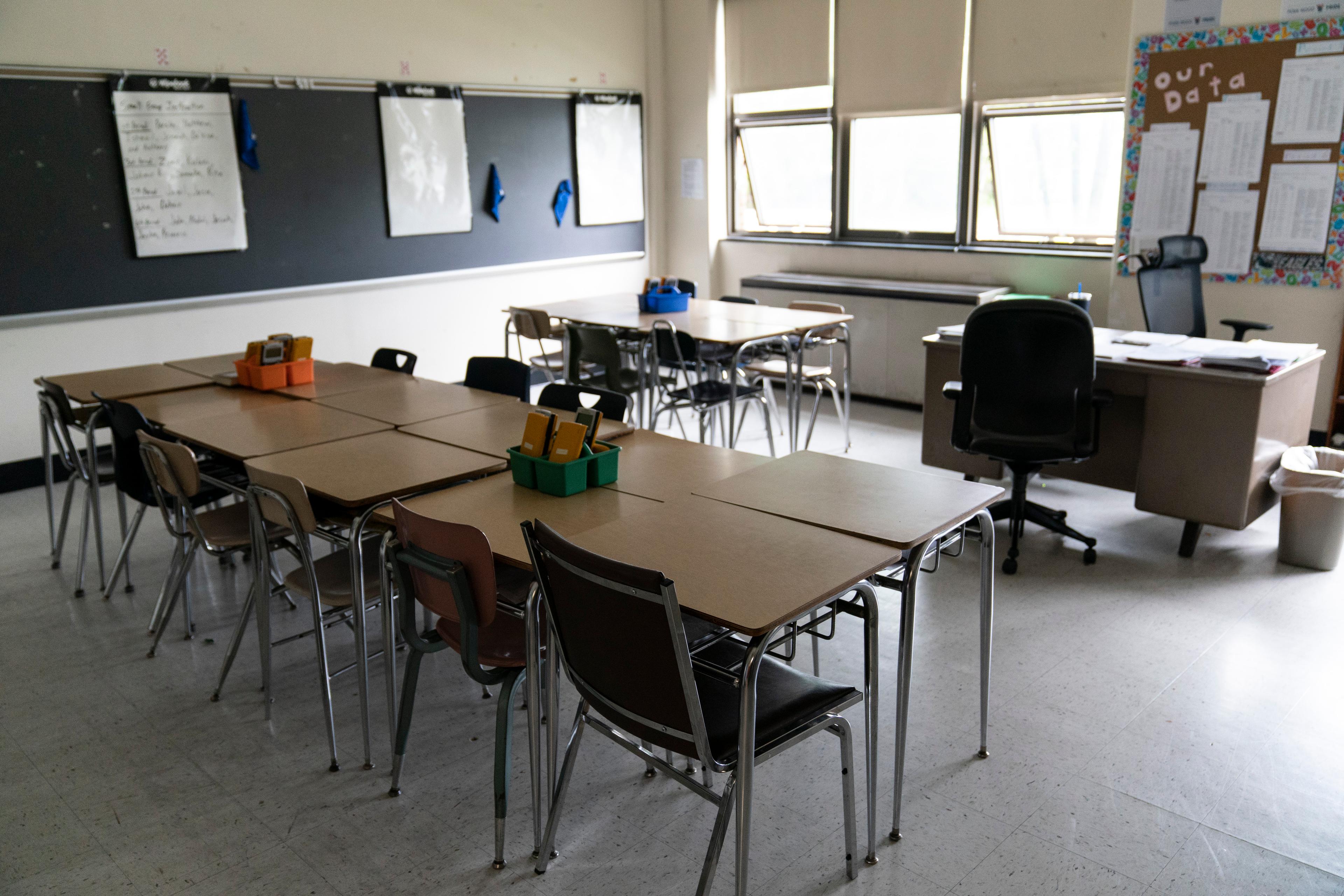 Desks fill an empty classroom.