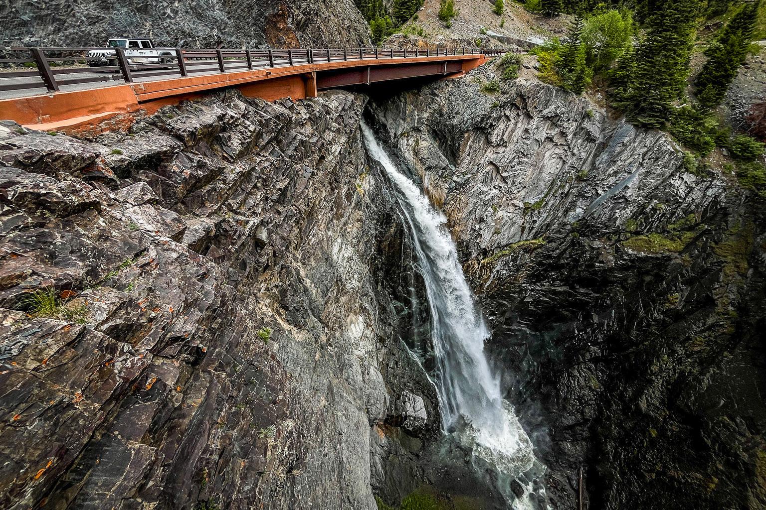 Water from Bear Creek Falls tumbles down a ravine