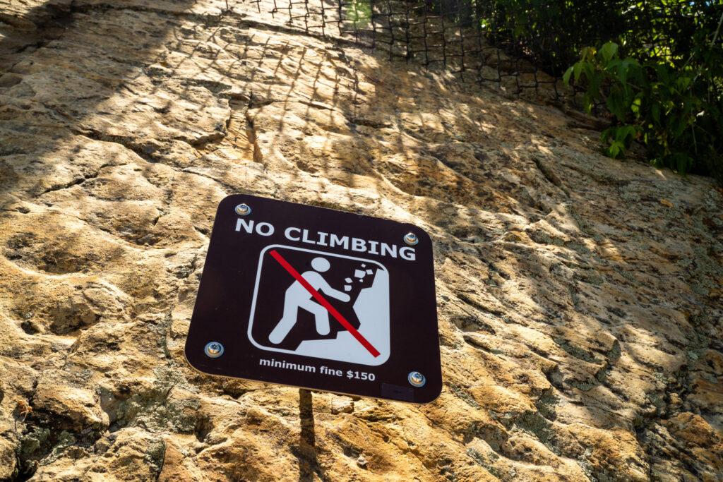 A signs warns no climbing at Dinosaur Ridge