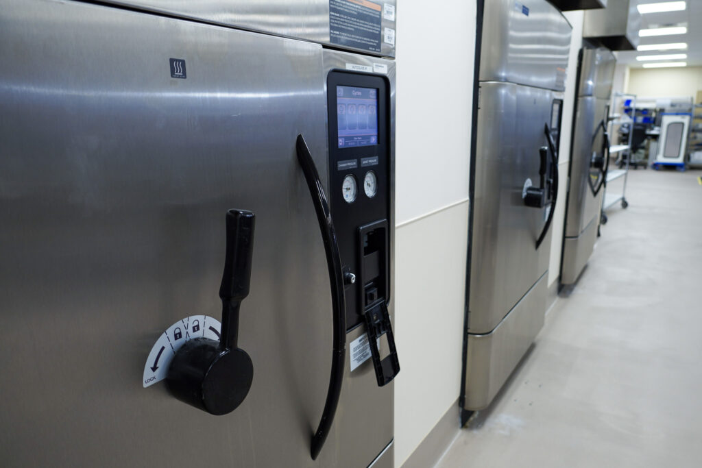 An autoclave uses steam to sterilize reusable medical equipment at Rocky Mountain Regional VA Medical Center in Aurora, Colo. A reusable medical device washer in sterile processing at Rocky Mountain Regional VA Medical Center in Aurora, Colo.