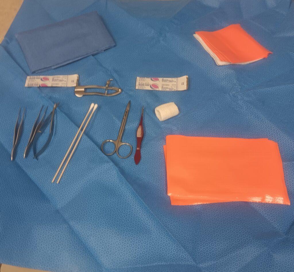 forceps, tweezers and other instruments are on a sterile field