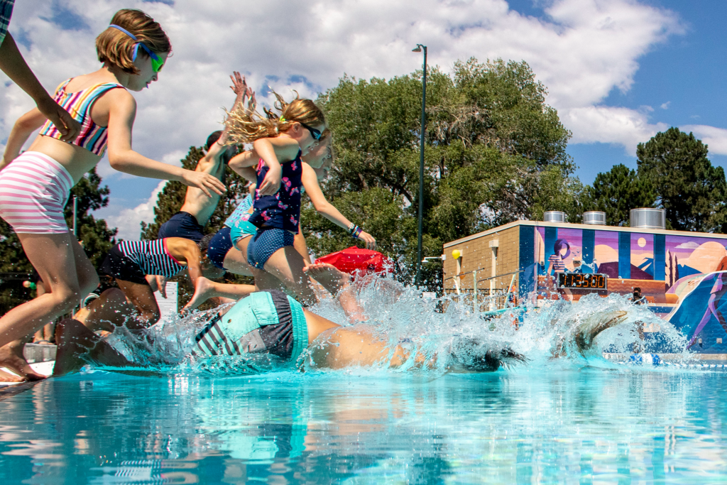 Kids leap into the newly renovated Congress Park pool.