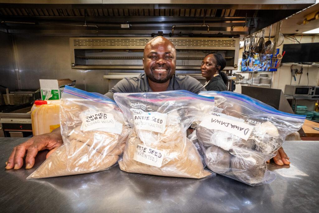 AFRICAN GRILL AND BAR’S SYLVESTER OSEI-FORDWUO WITH BAGS OF SPICE