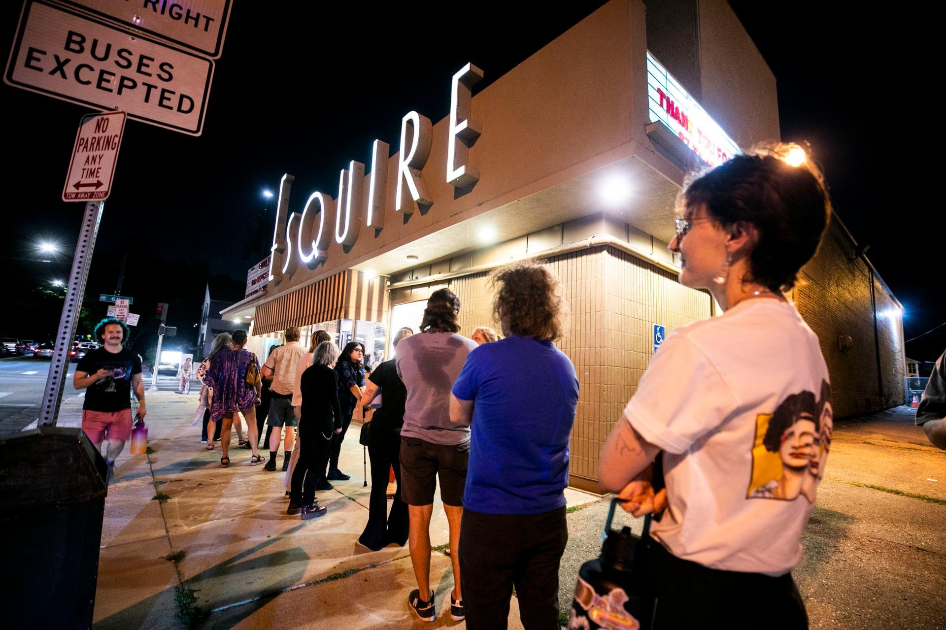 People wait in a long line outside the Landmark Esquire Theatre to see “2001: A Space Odyssey” during the last weekend before the theatre's closure.