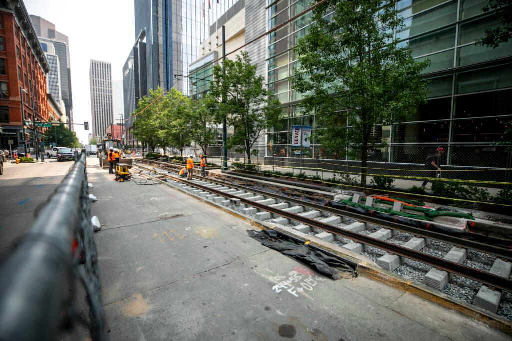 A crew works on an RTD light rail line downtown. July 23, 2024.