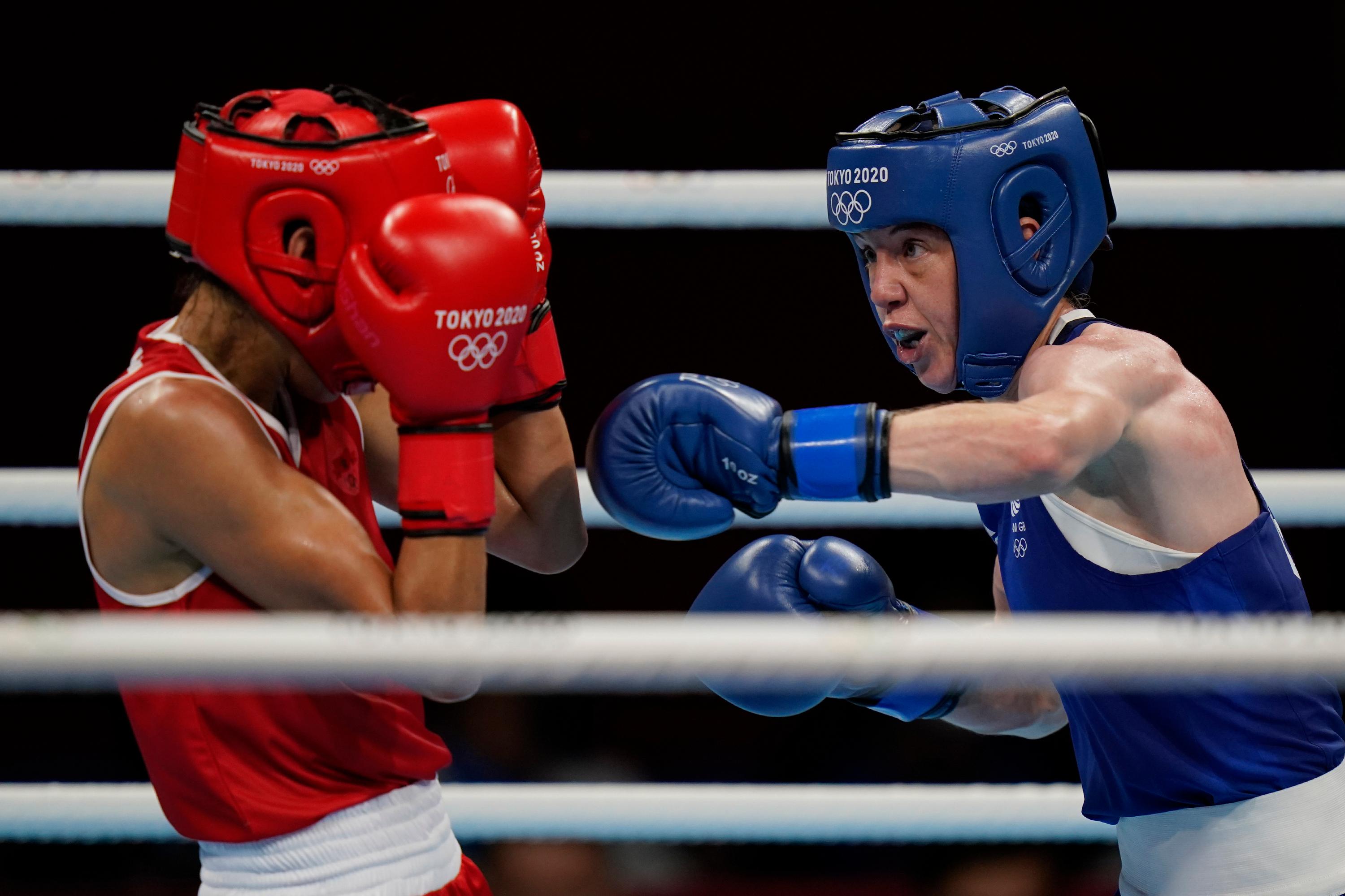 Two female boxers compete at the 2020 Summer Olympics in Tokyo, Japan.