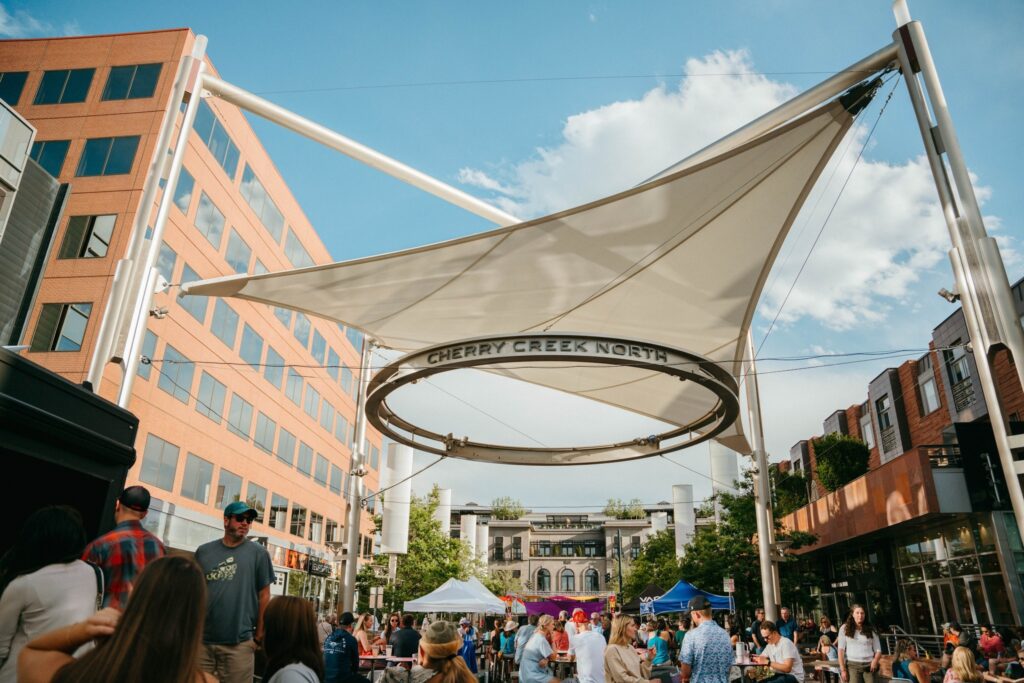 A bustling square full of people enjoying an event in Cherry Creek North.