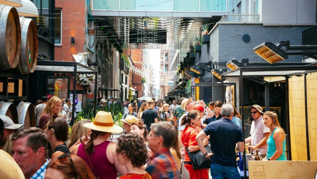 An alley packed full of people enjoying an event at Dairy Block in LoDo.