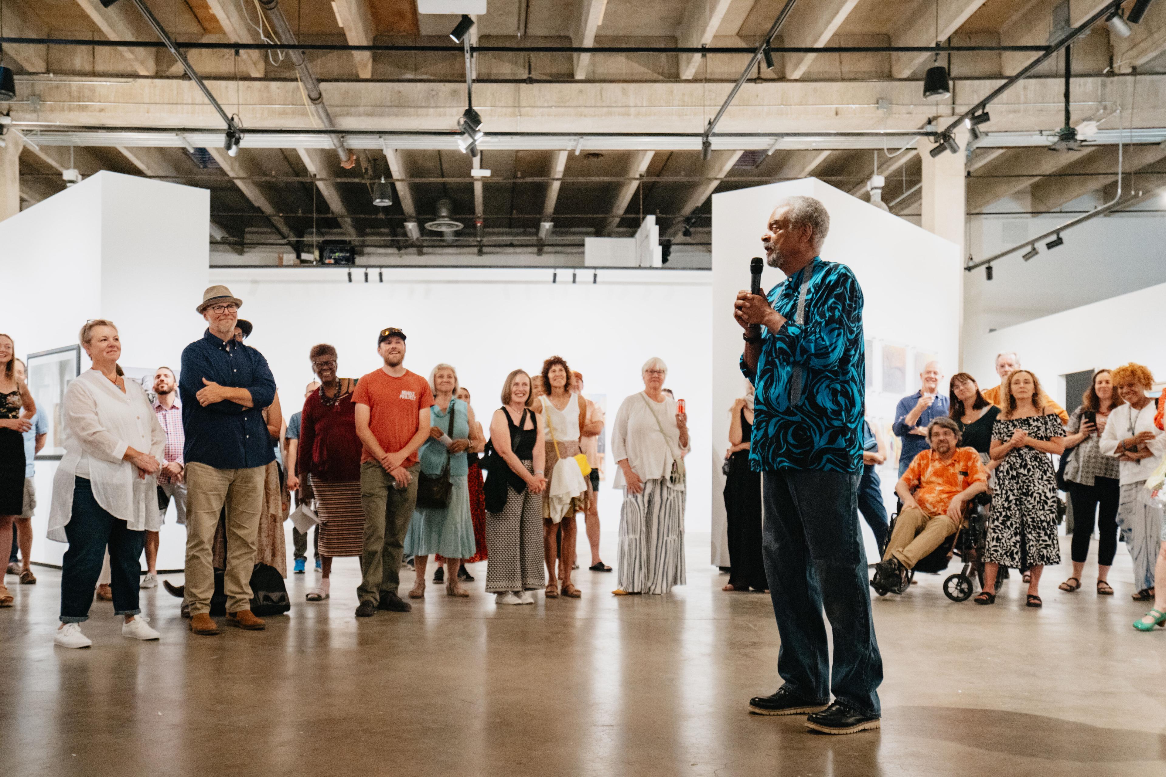 Artist Darrell Anderson addresses the crowd at RedLine Contemporary Art Center