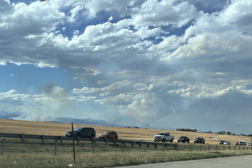 View of the Stone Canyon and Alexander Mountain fires burning from I-25.