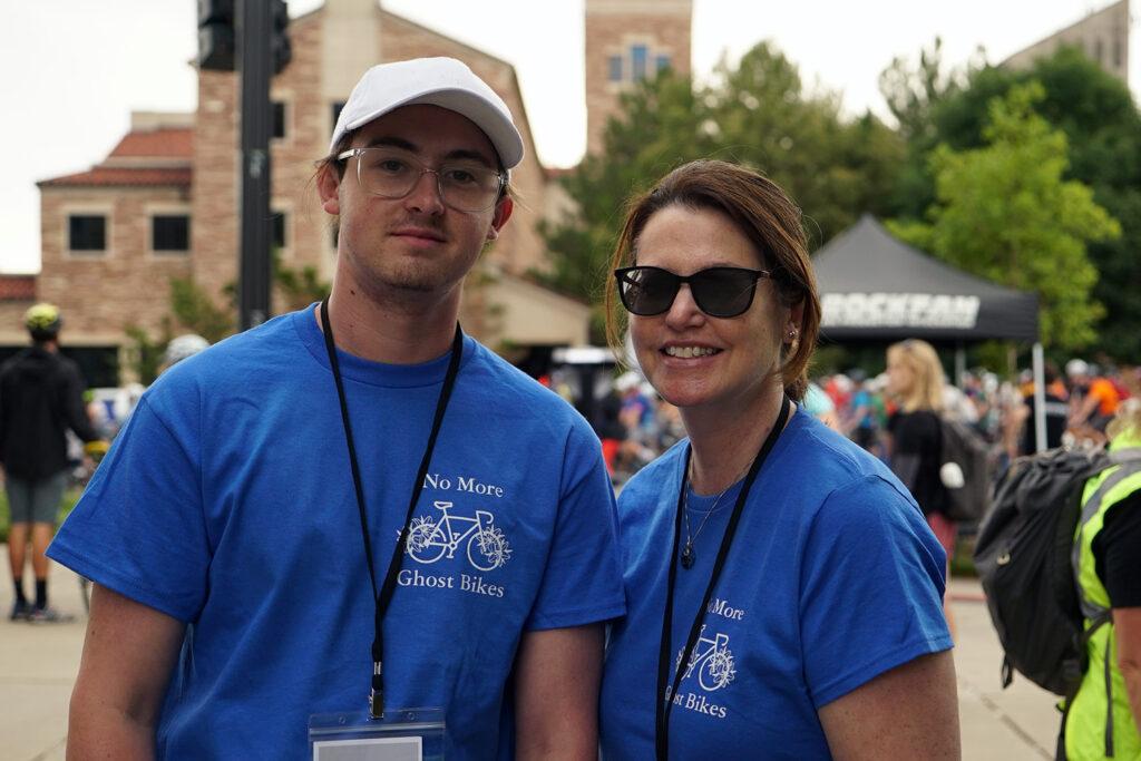 A man and women wearing shirts that say "no more ghost bikes" pose for a picture.