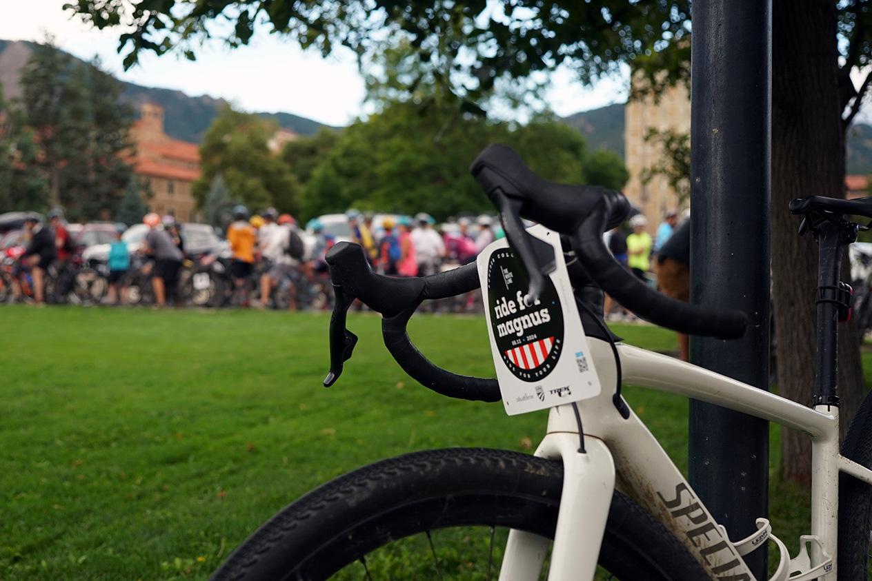 A bike with a tag reading "Ride for Magnus" on its handlebars .