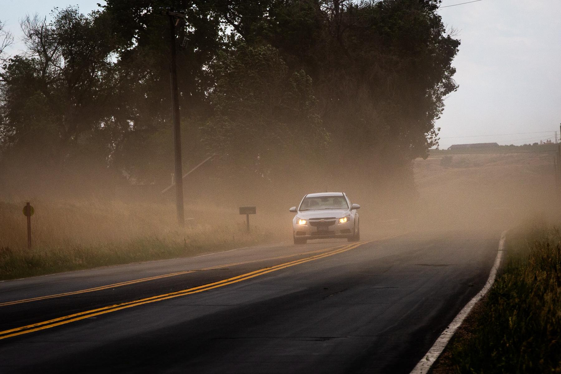 Wind blows dirt across a highway in Weld County