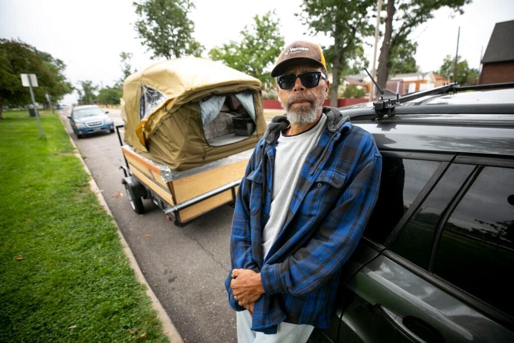 Mark Gaskin leans against his car