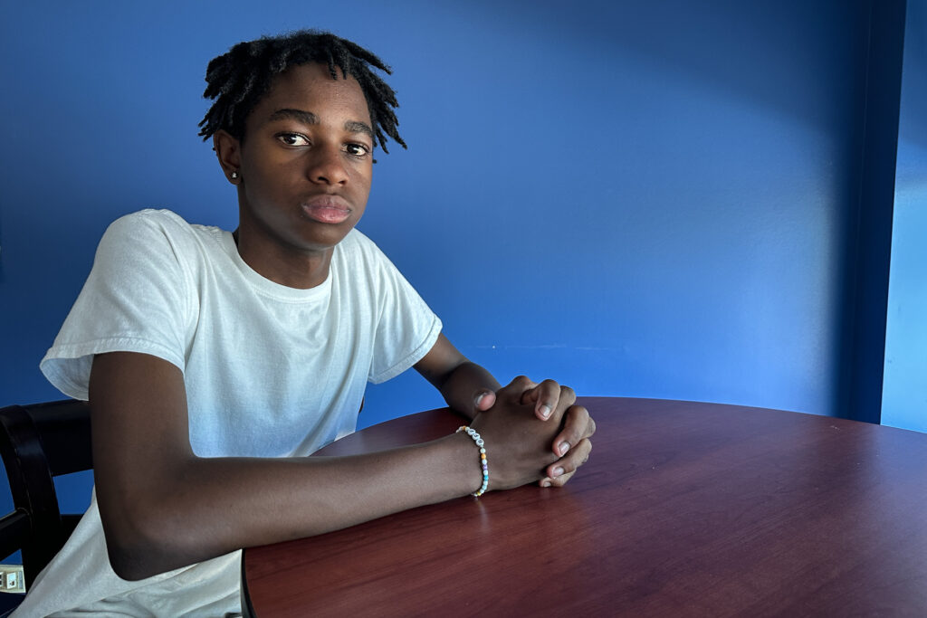 A high school student poses for a photo