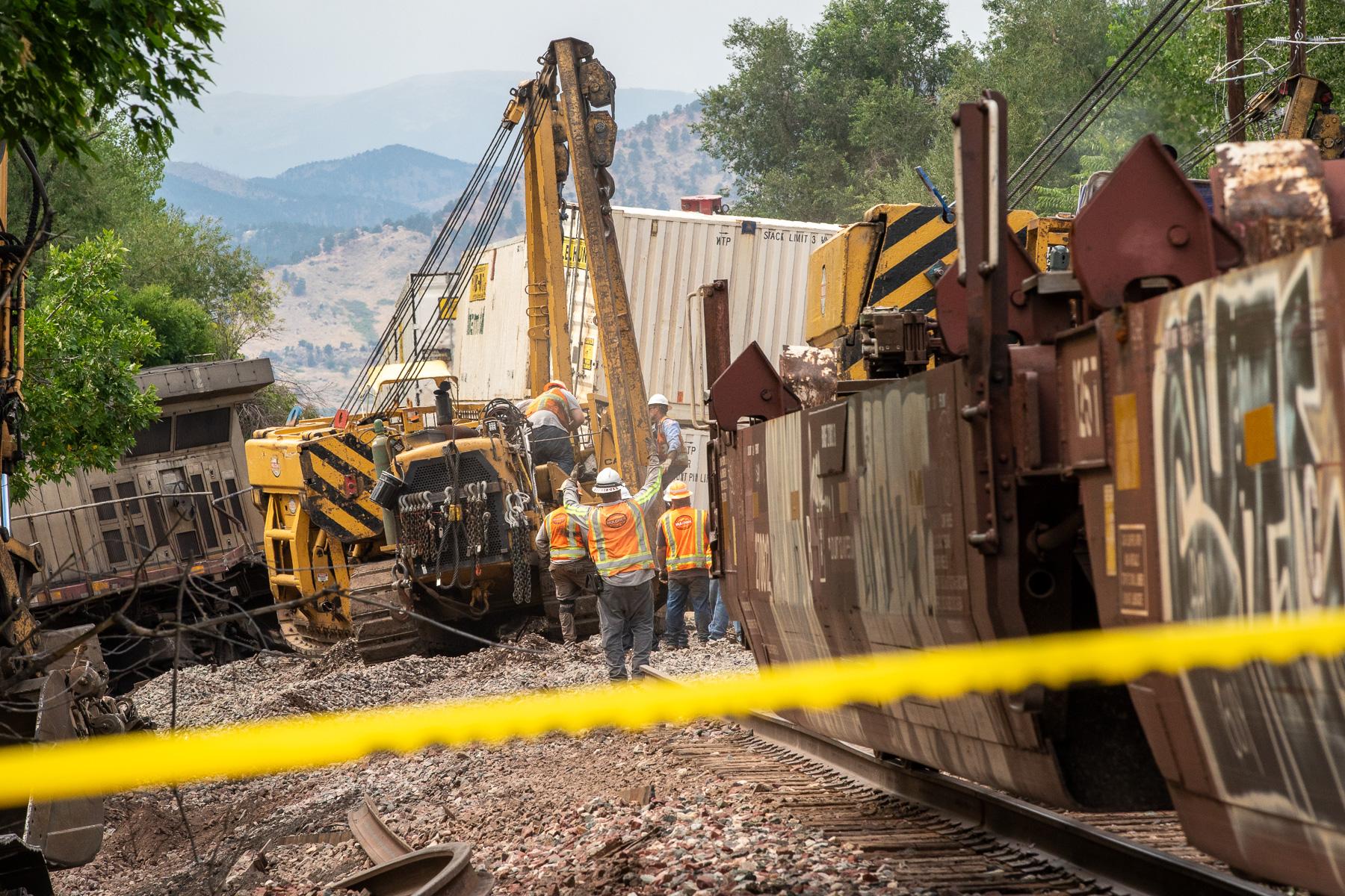 Crews work to clear a BNSF freight train crash in Boulder