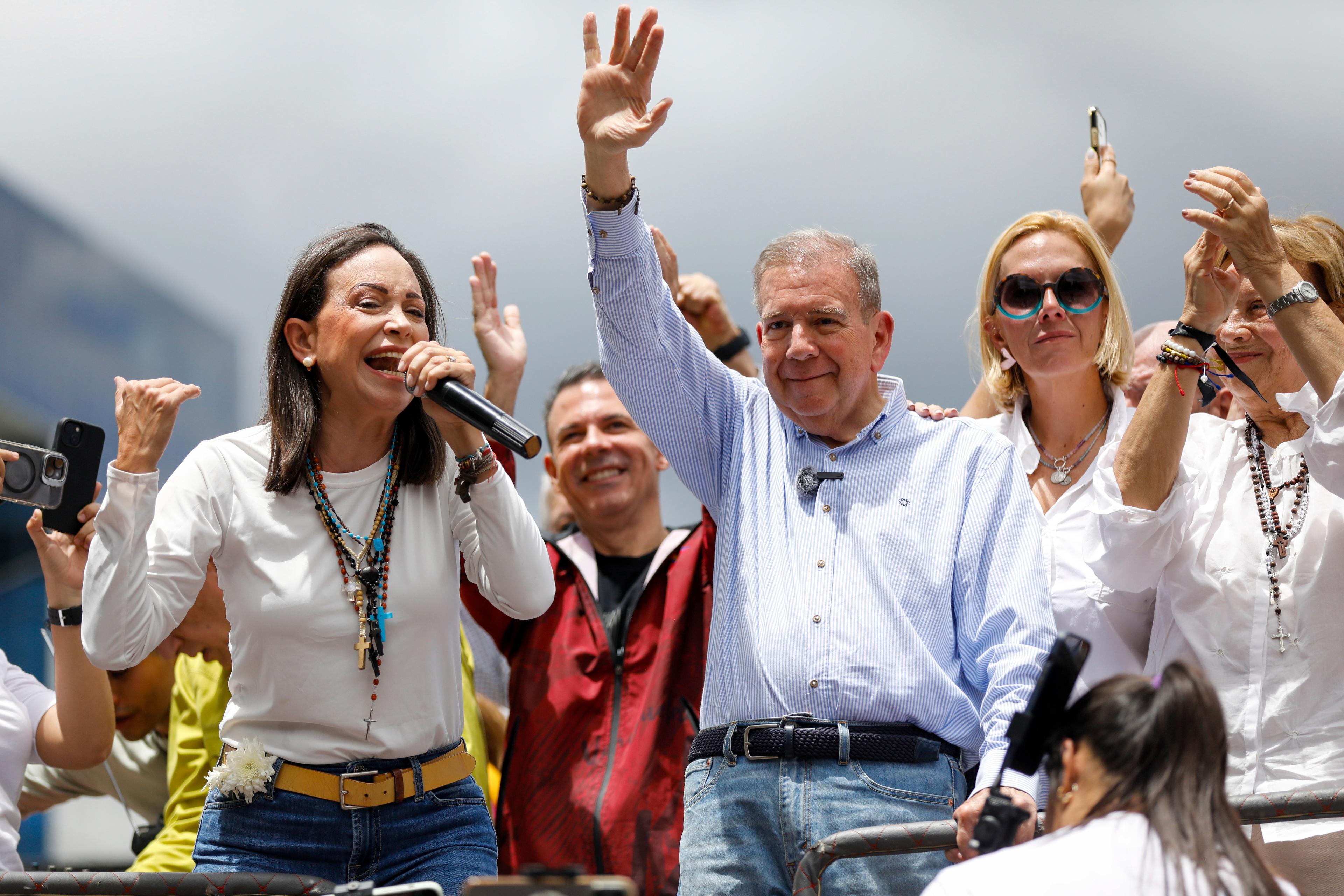 A group of people outside waving