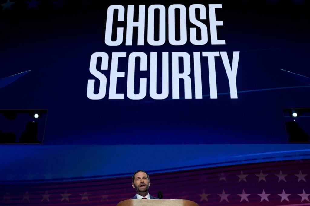 Colorado Rep. Jason Crow spoke under a huge screen displaying the words &quot;Choose Security&quot; at the 2024 Democratic National Convention.