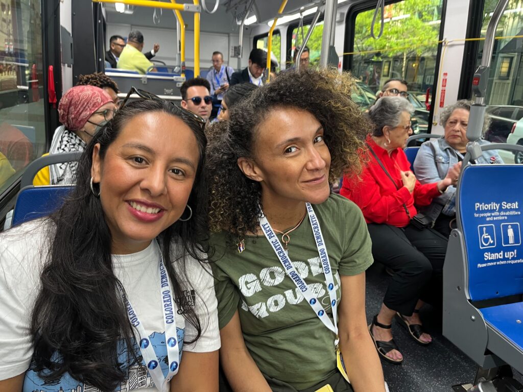 Two Colorado delegates to the DNC pose for a photo on their way to a day of meetings.