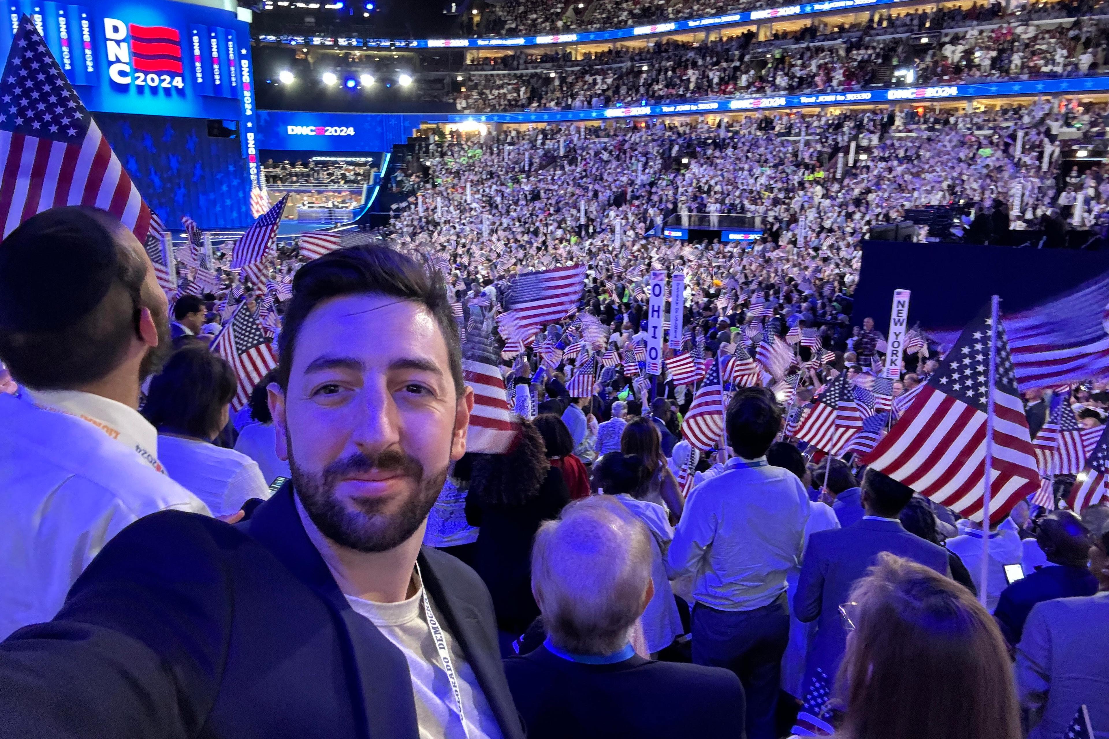 Erik Clarke of Denver takes a selfie at the Democratic National Convention in Chicago with the crowd of delegates behind him.