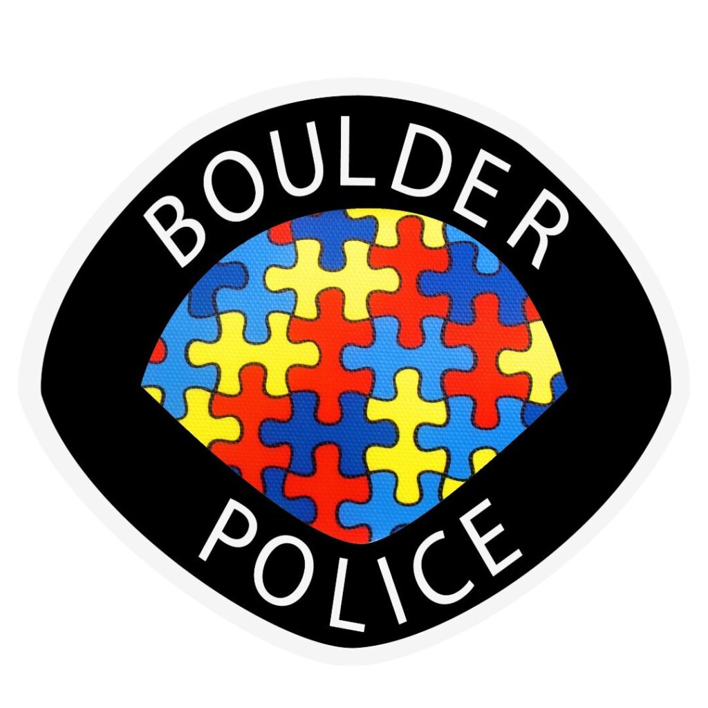 A newer Autism awareness decal, with a black border that reads &quot;Boulder Police&quot; and contains a red, yellow and blue puzzle pieces.