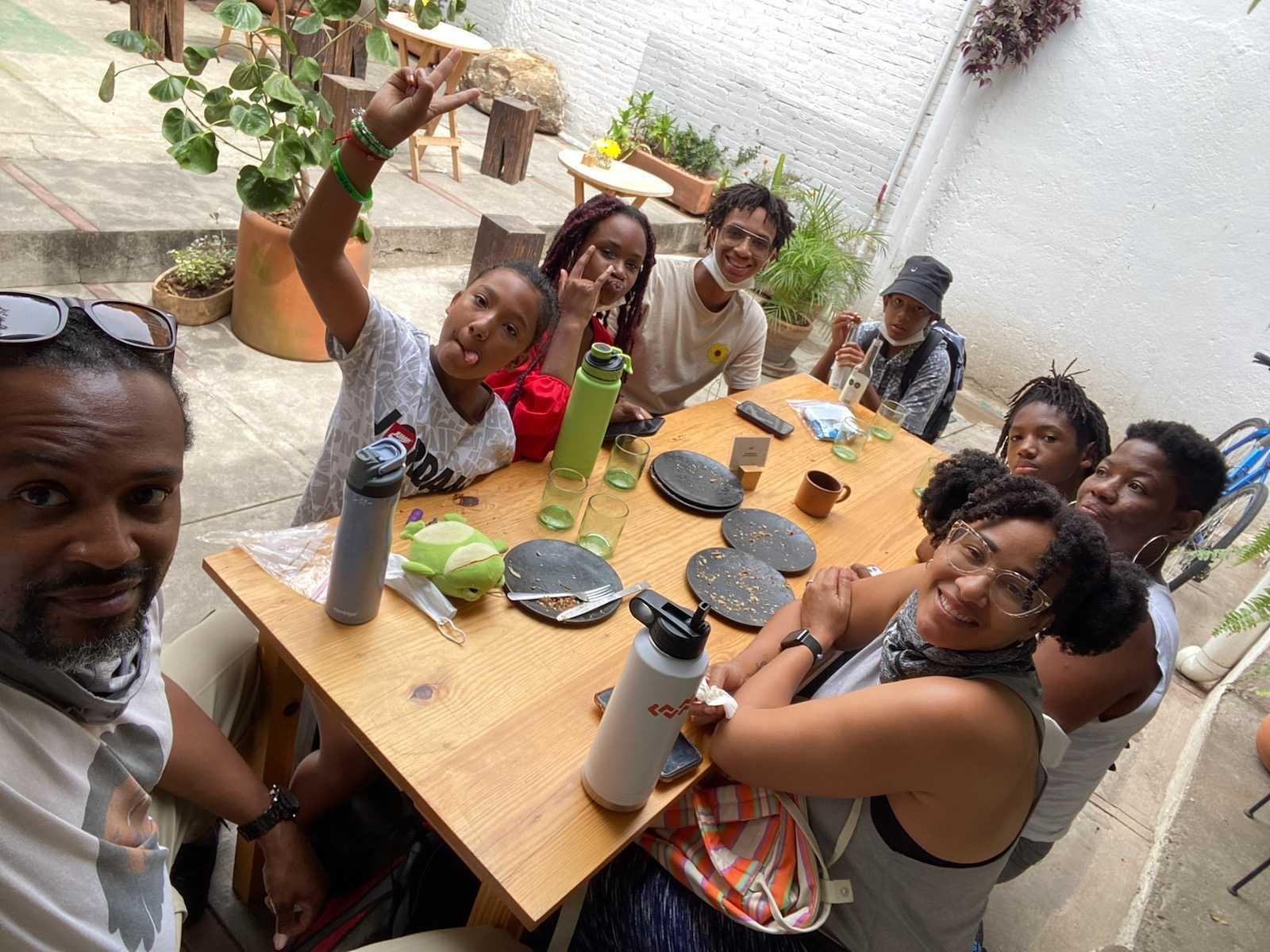 Members of the Wells family seated at a table in Mexico.