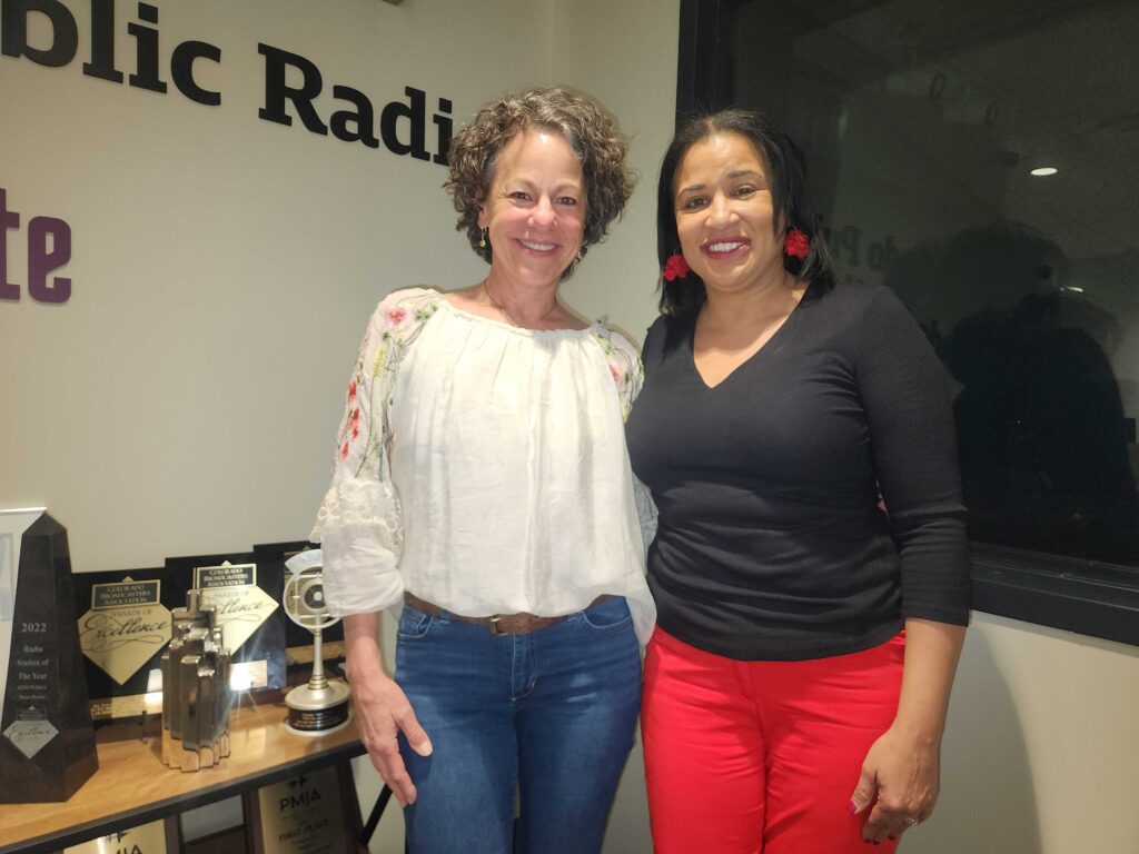 Author Julie Frieder is seen outside the CPR News studios with Colorado Matters host Chandra Thomas Whitfield.