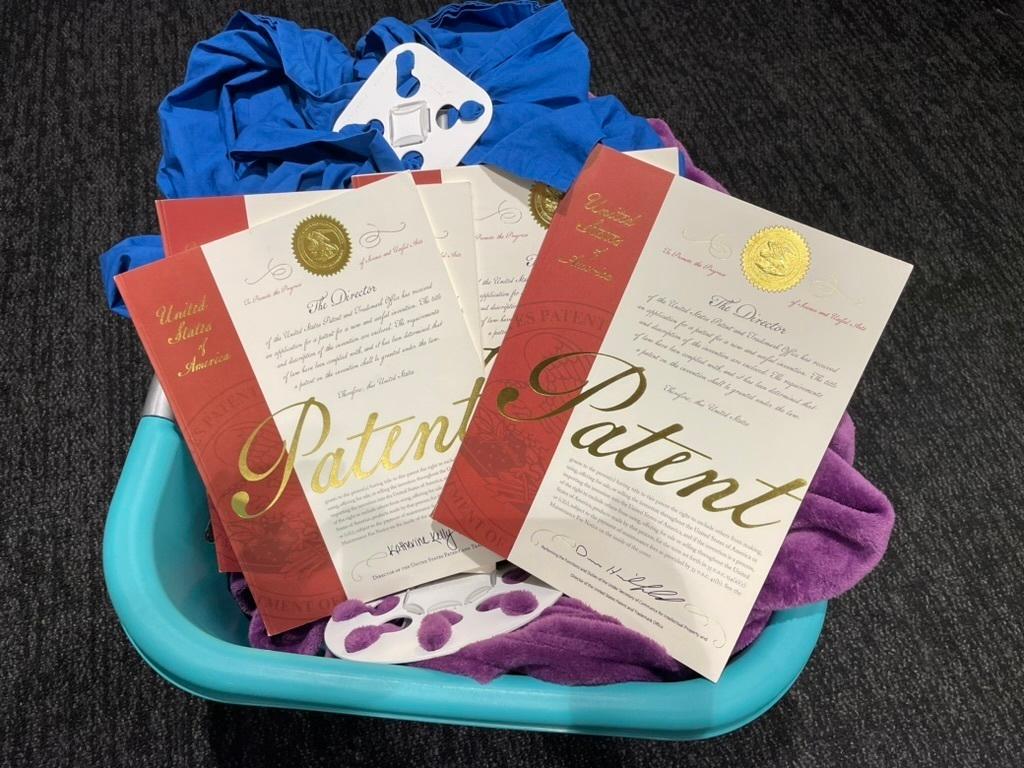 A basket that shows some of the patents Denver inventor Cyndi Bray has received for creating Wad-Free, a laundry detangler.