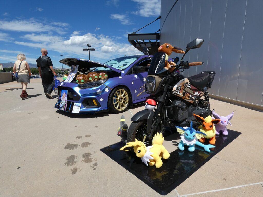 a black motorcycle with toys around it.