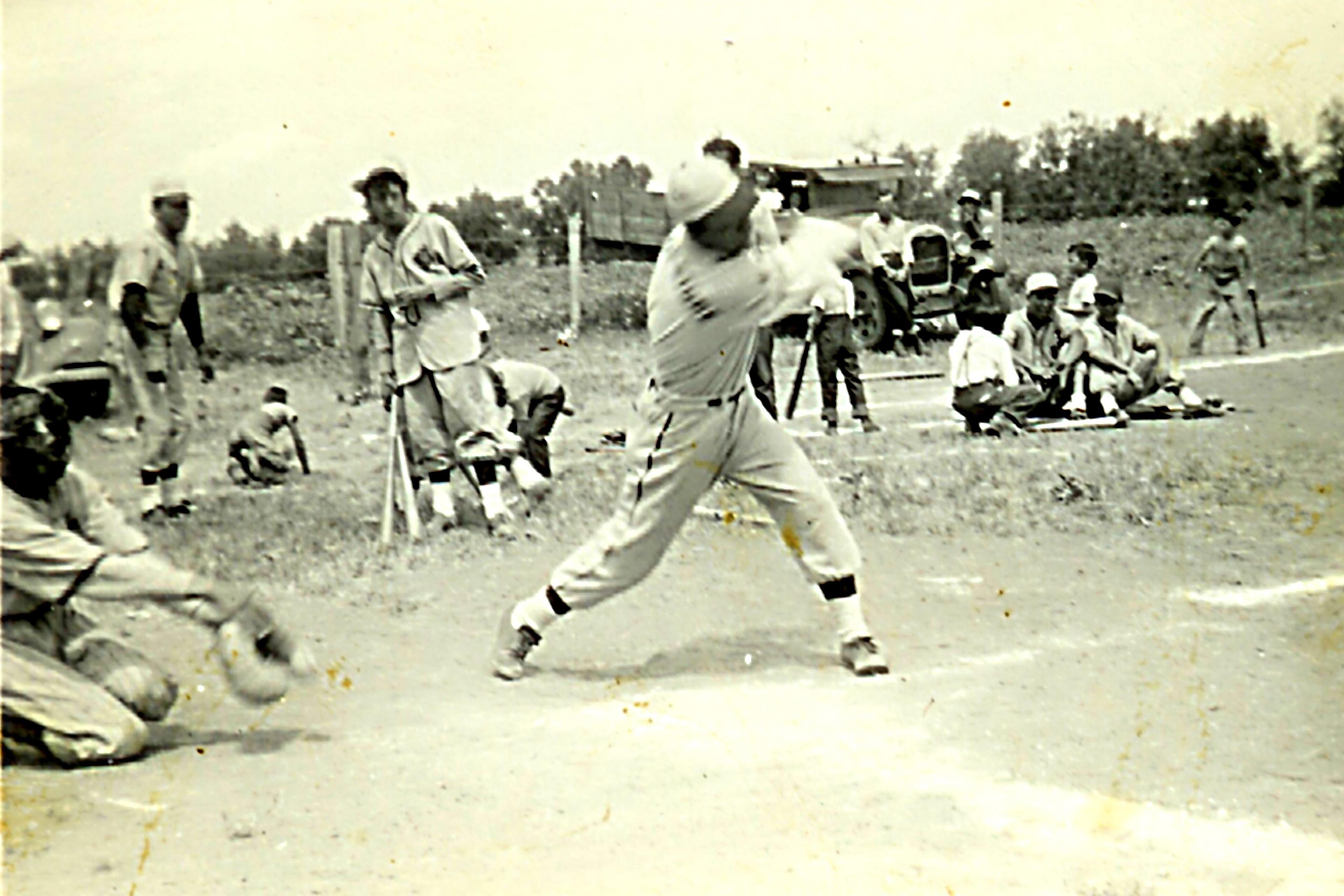 Migrant sugar beet farm workers play baseball in this 1937 photo in northern Colorado.