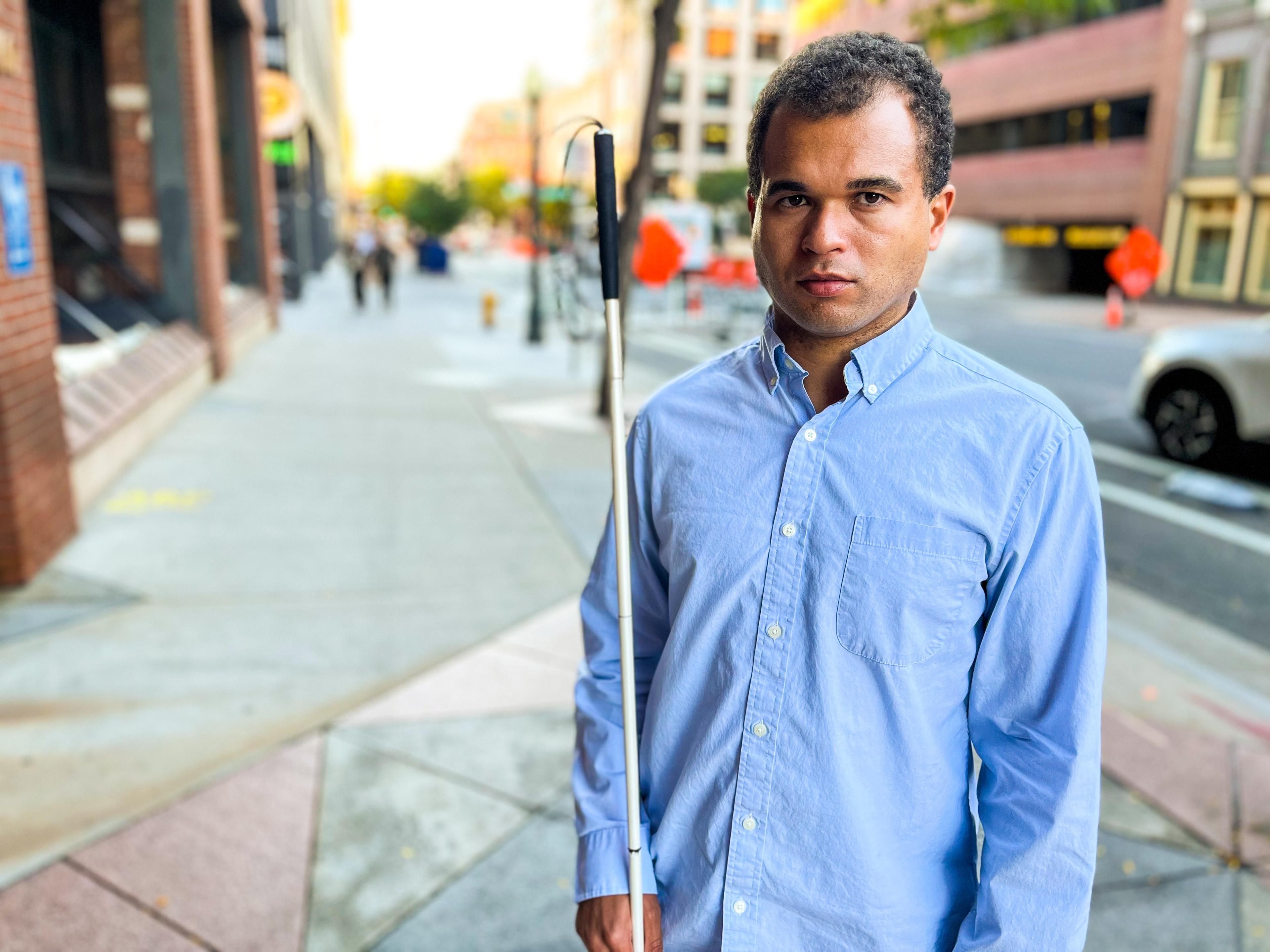 Charles David of Centennial poses for a portrait outside of RTD’s offices