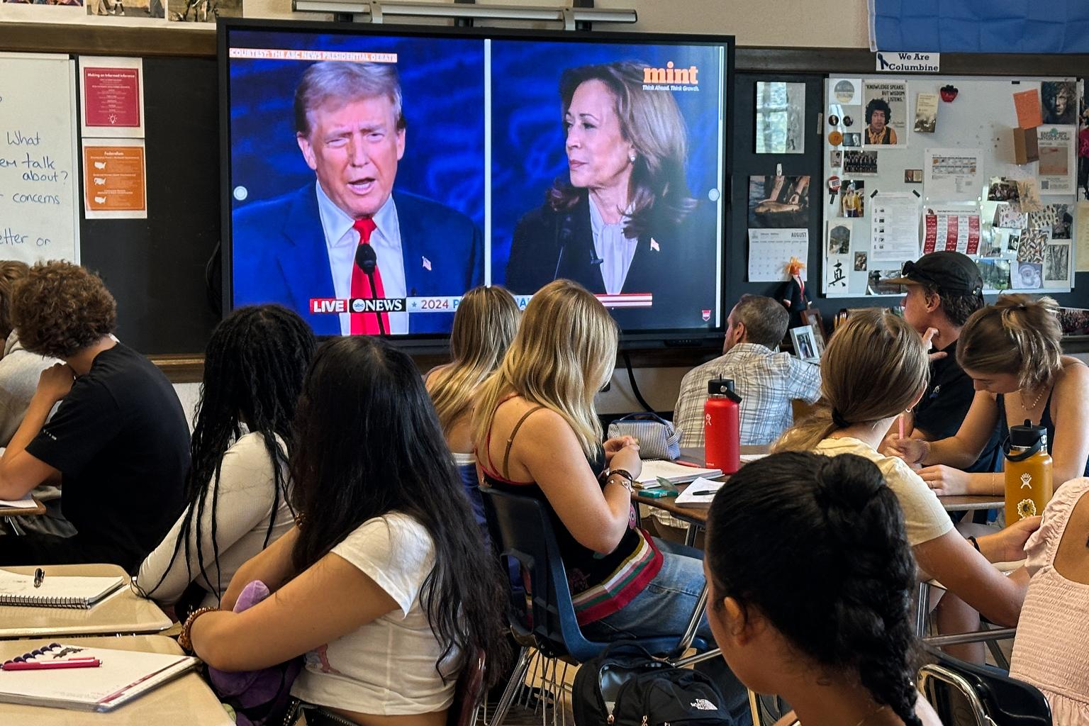 High school students watch a video in class.