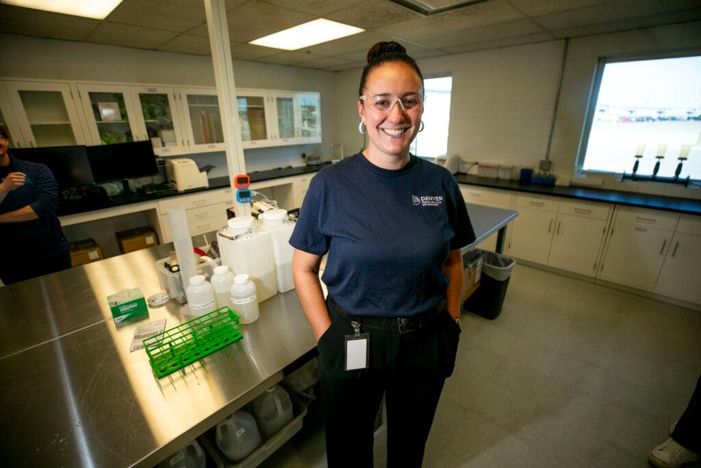 Marie Curran stands in a water treatment facility lab.