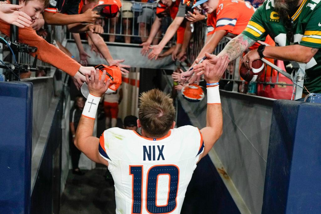 Denver Broncos quarterback Bo Nix greets fans