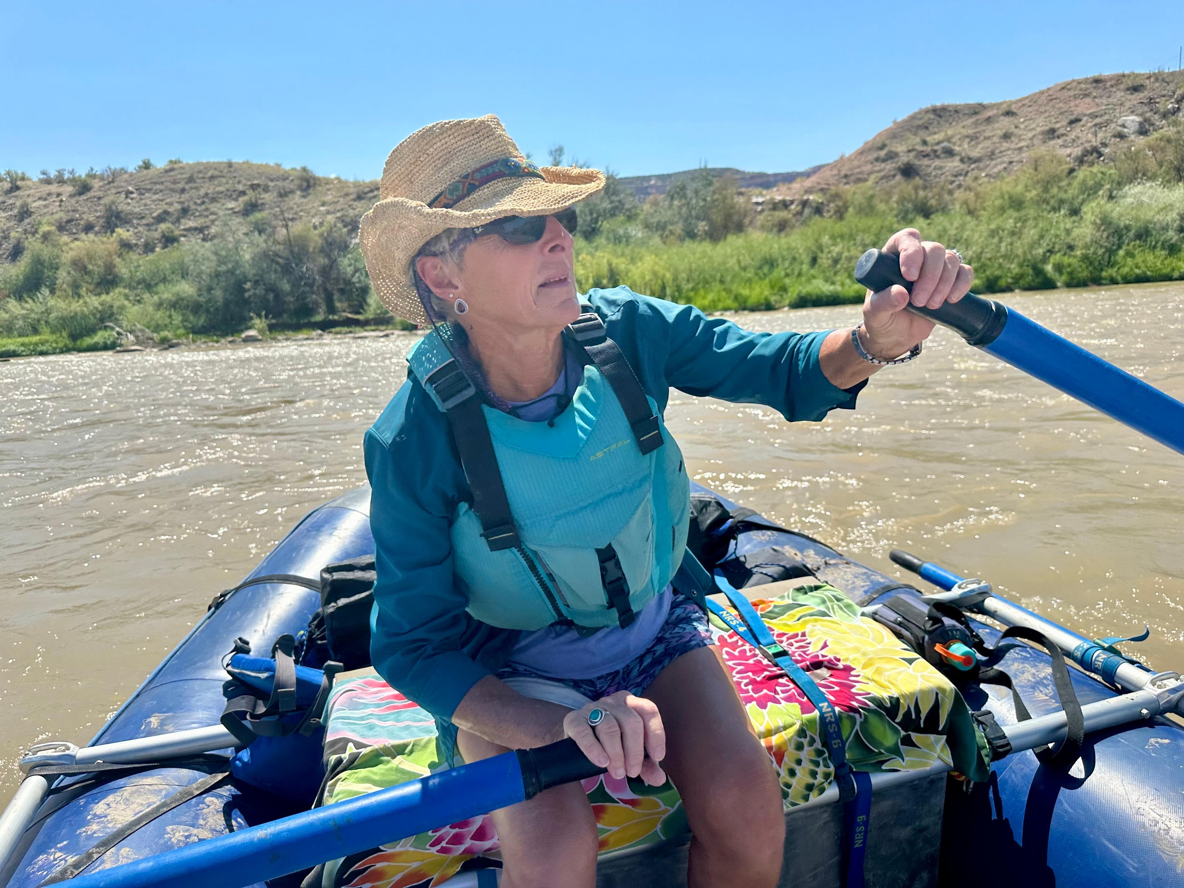 Zan Merrill pictured rowing in her raft down the Colorado River.