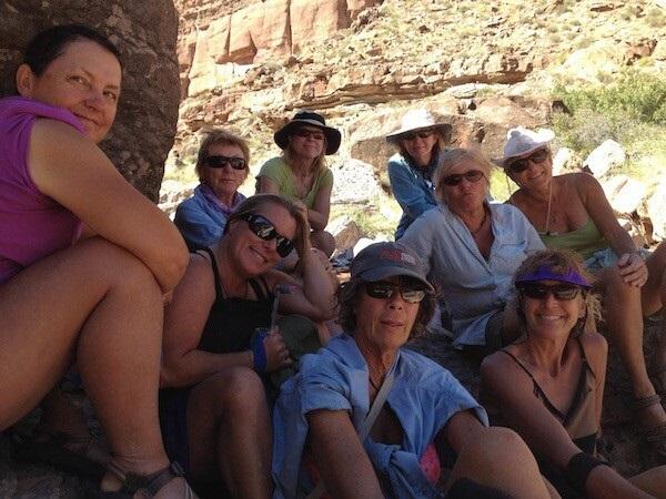 A group of women rafters pose for a photo along the Colorado River.