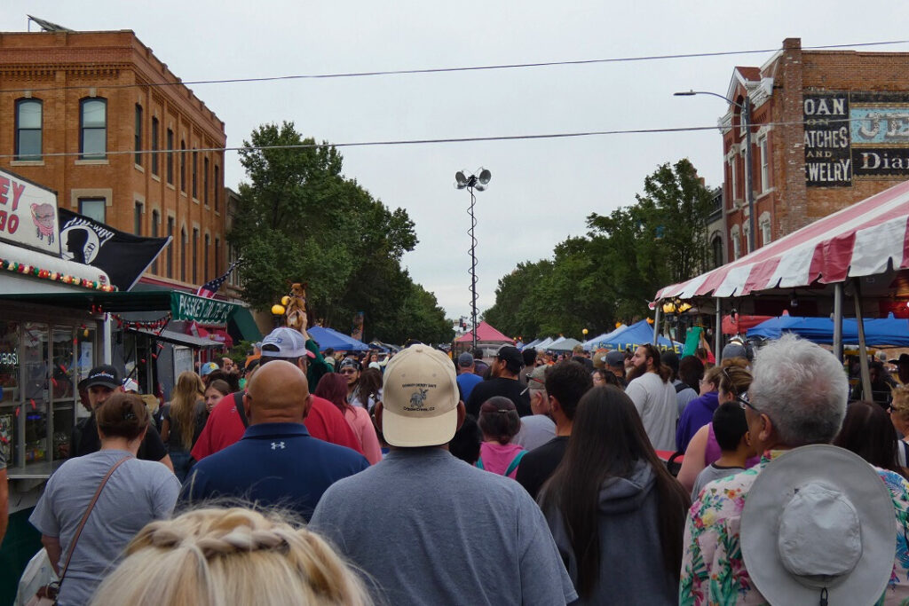 A crowd of people walking outdoors