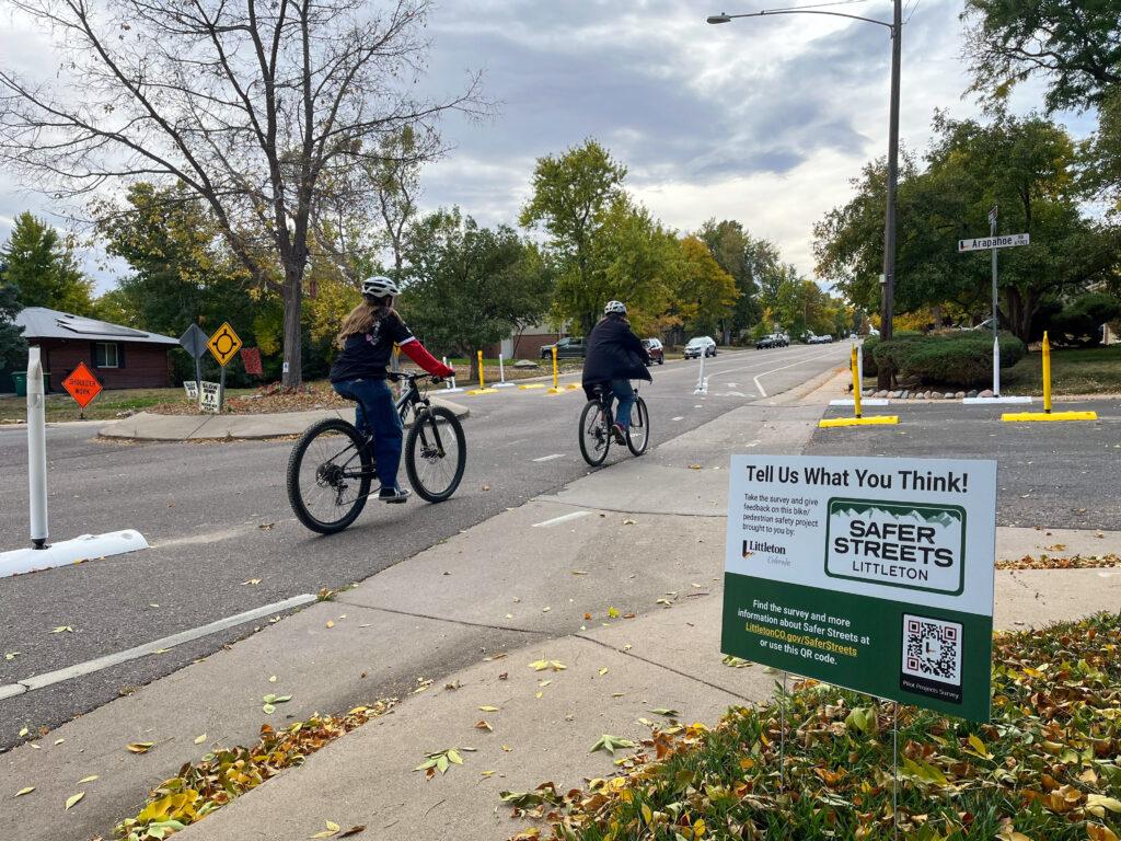 Cyclists ride through an street intersection where a young boy was killed