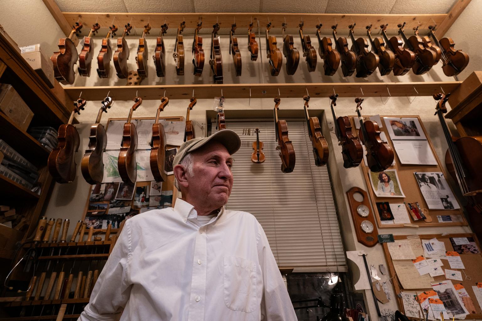 Pablo Mijares in his Colorado Springs workshop surrunded by violins