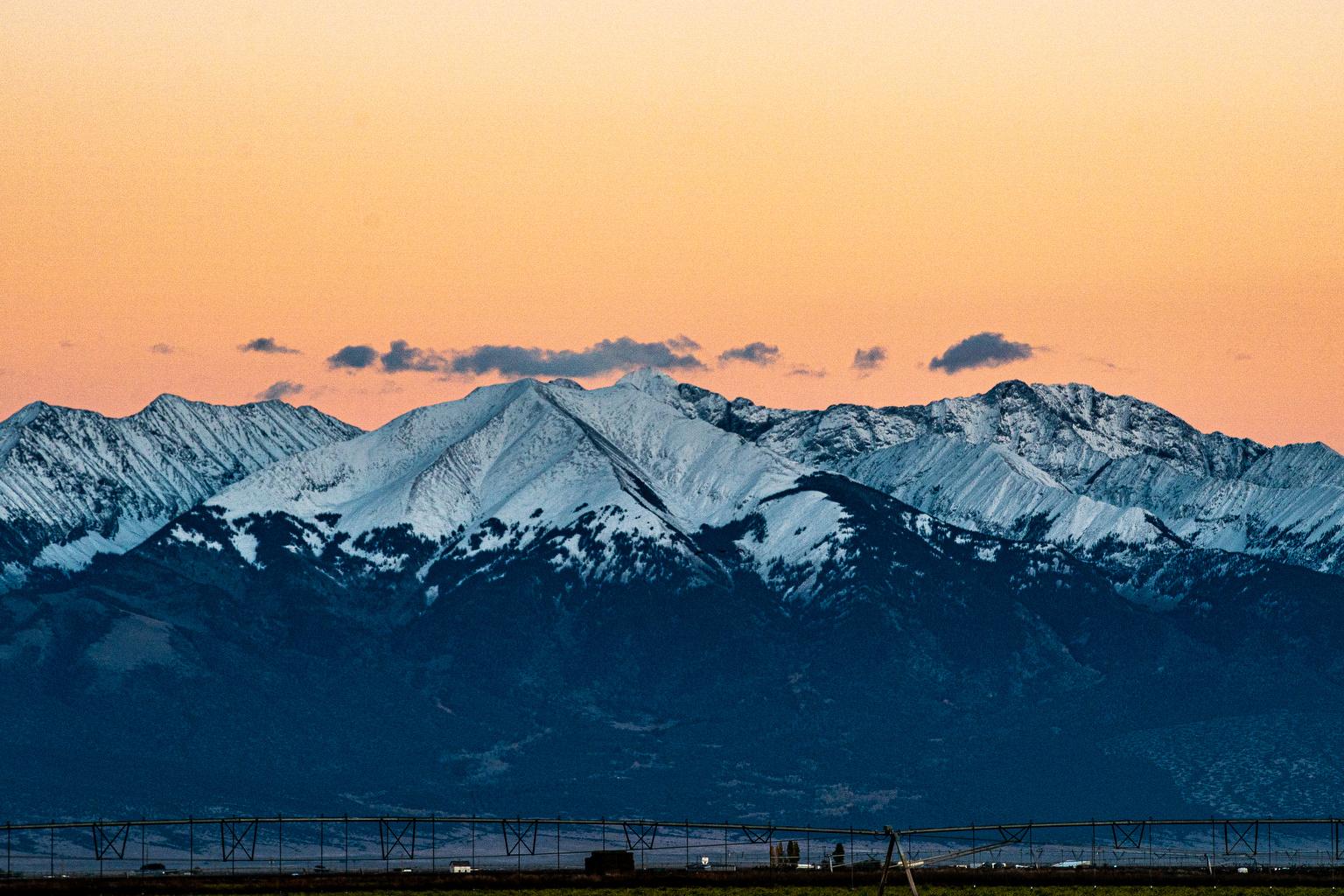 Golden evening sky over snow-covere Sangre de Cristo mountains