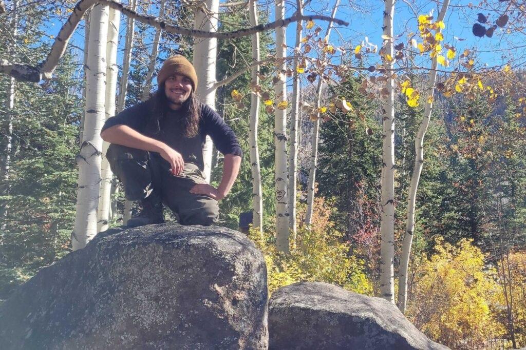 Colin Lee is seen on top of a larger boulder in the Betty Ford Alpine Gardens in Vail, Colo.