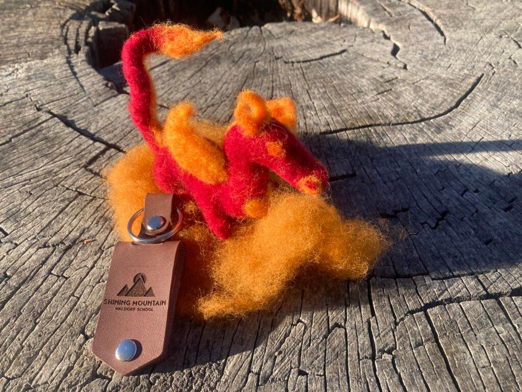 Photo shows a small felt dragon which astronaut Sarah Gillis brought with her into space on the Polaris Dawn mission.