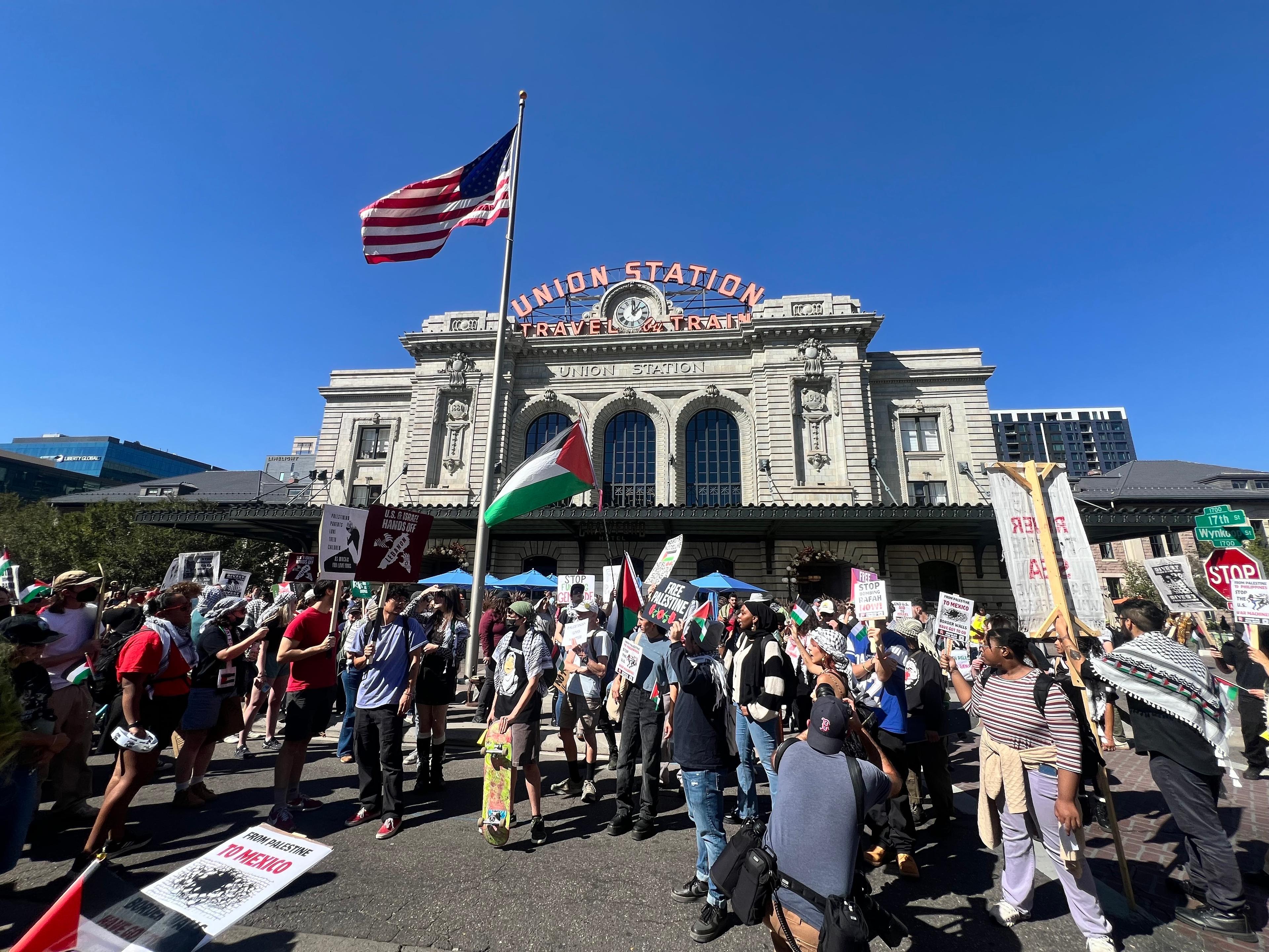 A group of people protest outside a building