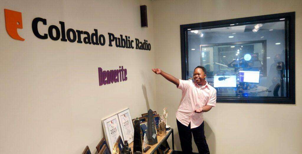 The picture shows Jeremiah Daniels, a 12-year-old Aurora boy, pointing to the CPR sign on our studio wall.