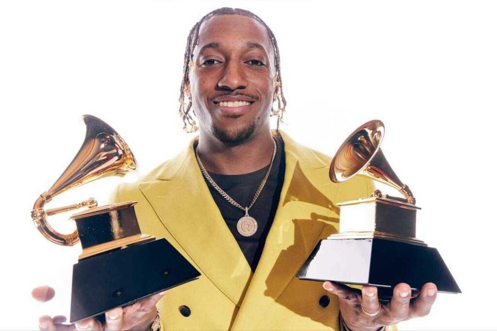 Christian rapper Lecrae is seen posing with two Grammy awards he received in 2024.