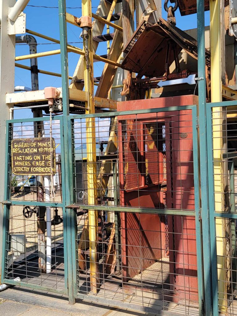 The tourists in the red cage go in to explore the Mollie Kathleen Gold Mine.