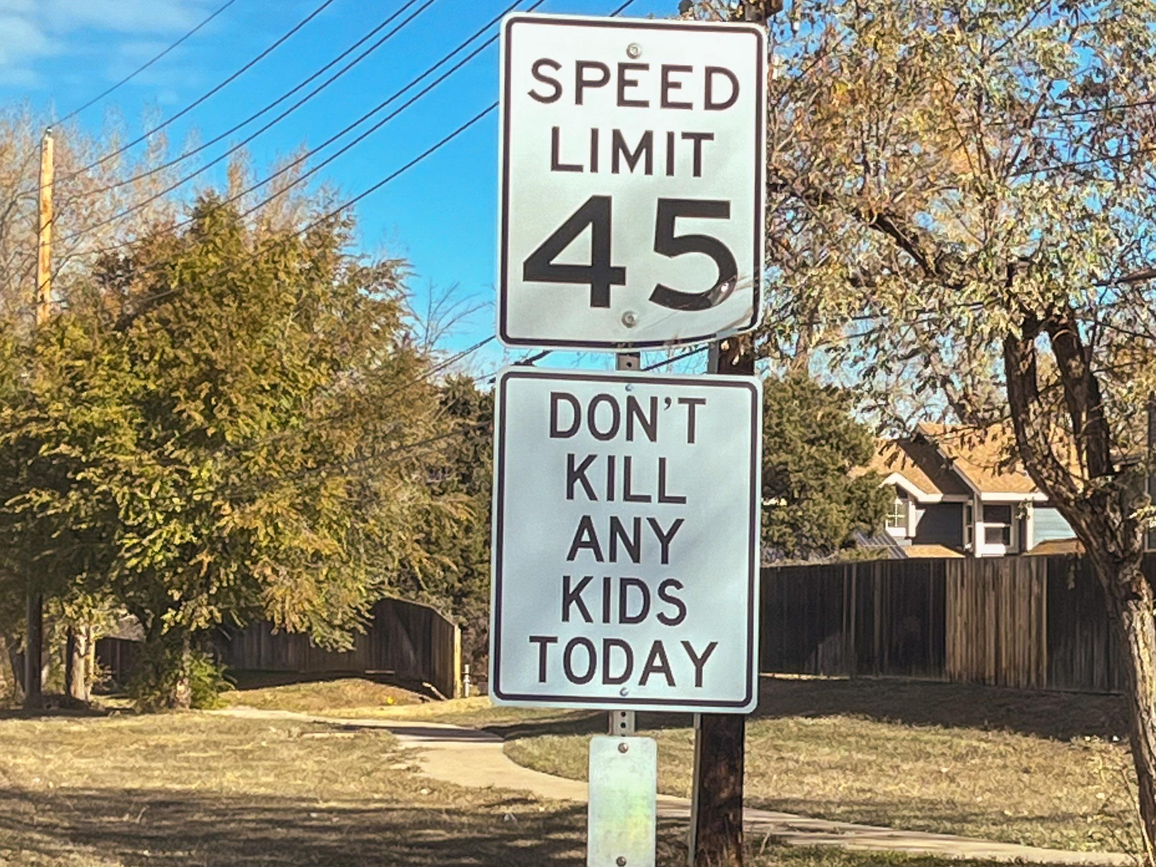 An unauthorized street sign along a road