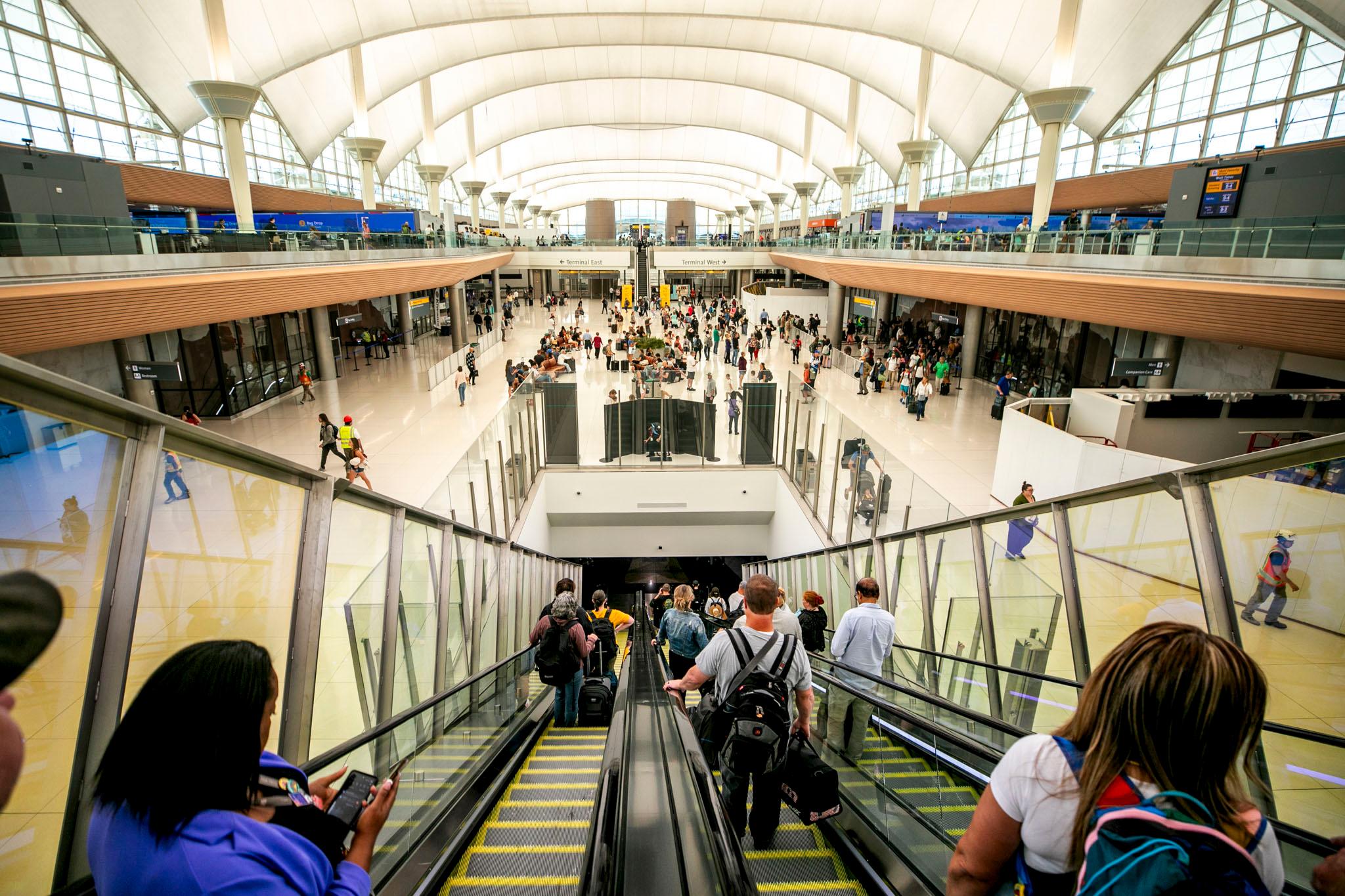 Passengers head down to the trains, after security at Denver International Airpor